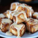 Cinnamon Roll French Toast Bites on a Serving Plate